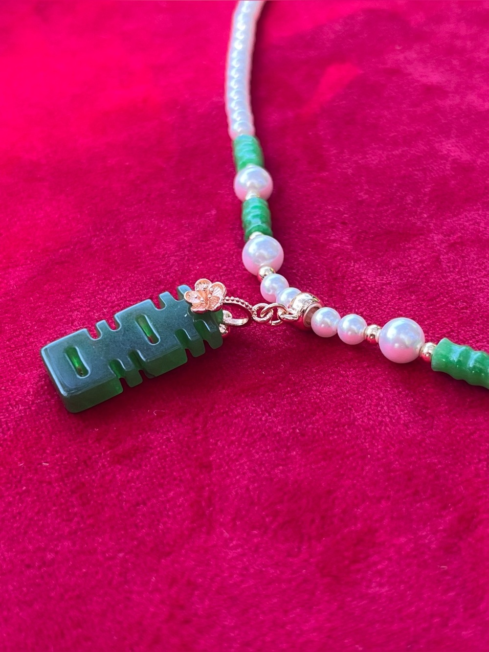 Handmade yingluo necklace with green “happiness” pendant